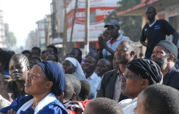 Residents of Eastleigh gather to listen to prayers and messages of peace at the scene of the blast