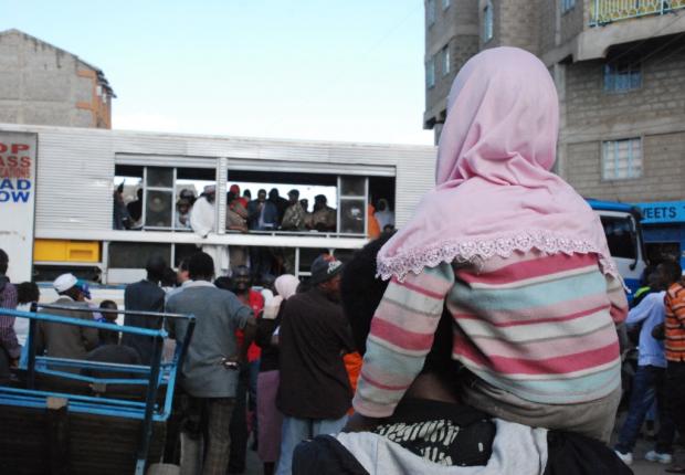 Residents of Eastleigh gather to listen to prayers and messages of peace at the scene of the blast