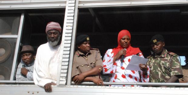Workshop participant Aysha Dafalla reads a Peace Declaration from an open-air truck at the scene of the bomb blast in Eastleigh. Also present, from left to right, Pastor James Wuye, Imam Muhammad Ashafa, District Commissioner Omar Beja and District Commisioner George Natembeya.