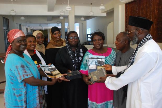 Pastor James Wuye and Imam Muhammad Ashafa present DVDs and the Resource Guide of An African Answer to the organizing teams from the Minda and Eleka Trusts.