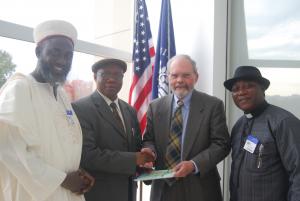 Dr David Smock, USIP receives Dr Golwa, Director General, Institute for Peace and Conflict Resolution of the Ministry of Foreign Affairs, Nigeria, and Imam Ashafa and Pastor Wuye (Photo: Kathy Aquilina)