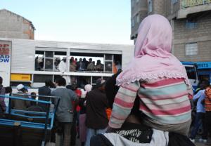 Residents of Eastleigh gather to listen to prayers and messages of peace at the scene of the blast 