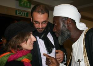 Imam Muhammed Ashafa talks with film producter Dr Imad Karam and his wife Amira (Photo: Louise Jefferson)