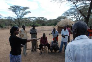 Maryann Ntausian asks a group of Njemps people, who lost all their cattle during a raid by another community, about their hopes for the future (Photo: Alan Channer)