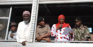 Workshop participant Aysha Dafalla reads a Peace Declaration from an open-air truck at the scene of the bomb blast in Eastleigh. Also present, from left to right, Pastor James Wuye, Imam Muhammad Ashafa, District Commissioner Omar Beja and District Commisioner George Natembeya. 