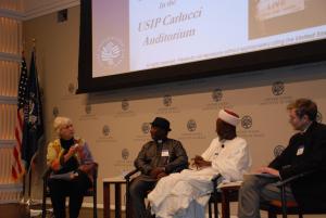 USIP: Maureen Fiedler moderating launch at USIP with Imam Ashafa and Pastor Wuye and Film Director Dr Alan Channer (Photo: Kathy Aquilina)