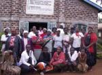 During a small group meeting, Joseph Wainaina (left) explains his part in coordinating the Peace Caravan in Eldoret