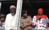 Workshop participant Aysha Dafalla reads a Peace Declaration from an open-air truck at the scene of the bomb blast in Eastleigh.  Also present, from left to right, Pastor James Wuye, Imam Muhammad Ashafa, District Commissioner Omar Beja and District Commisioner George Natembeya.