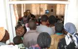 People crowd in to watch 'An African Answer' in Burnt Forest