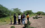 RAE Trust staff show the USIP/IofC team the difference between protected pasture (left) and land open to communal grazing.  The latter is prone to erosion by wind and flash floods.