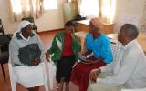 Sister Macrina Cheruto from the International Organization for Migration and Joseph Wainaina from Initiatives of Change offer counsel to Leah Muthoni (second left), a victim of the post-election violence, and Cecilia Kimemia, after the film screening.