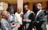 District Commissioner of Eldoret Christopher Wanjau and County Secretary Phillip Arap Meli receive DVD copies of 'An African Answer' from Pastor James Wuye and Imam Muhammad Ashafa. Joseph Wainaina is third from left.