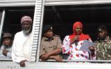 Workshop participant Aysha Dafalla reads a Peace Declaration from an open-air truck at the scene of the bomb blast in Eastleigh. Also present, from left to right, Pastor James Wuye, Imam Muhammad Ashafa, District Commissioner Omar Beja and District Commisioner George Natembeya.